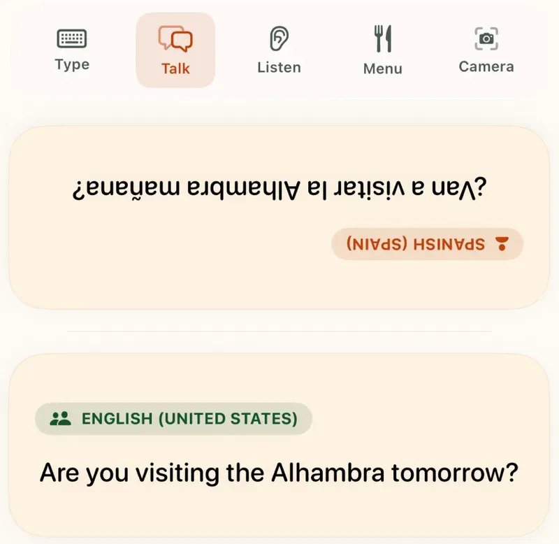 Flunqero's Talk mode on iPhone: the Spanish line "¿Van a visitar la Alhambra mañana?" shown upside down for the other person, above the English "Are you visiting the Alhambra tomorrow?"